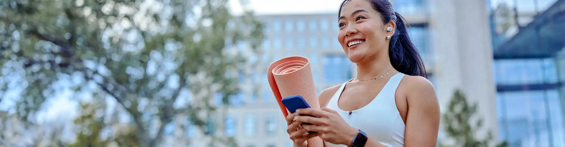 girl who does yoga uses smart phone