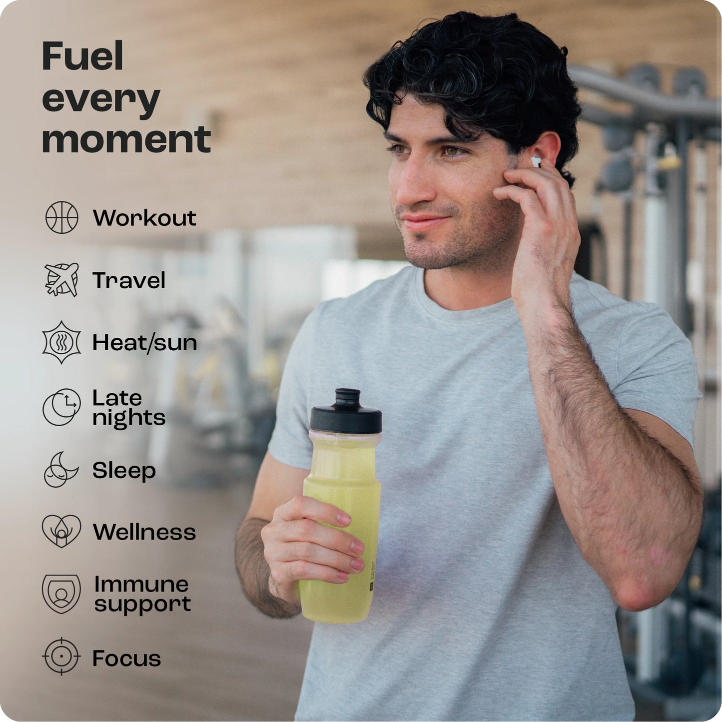 Man in gym with a yellow bottle, showcasing Electrolyte Recovery Plus Powder benefits for workout and travel.