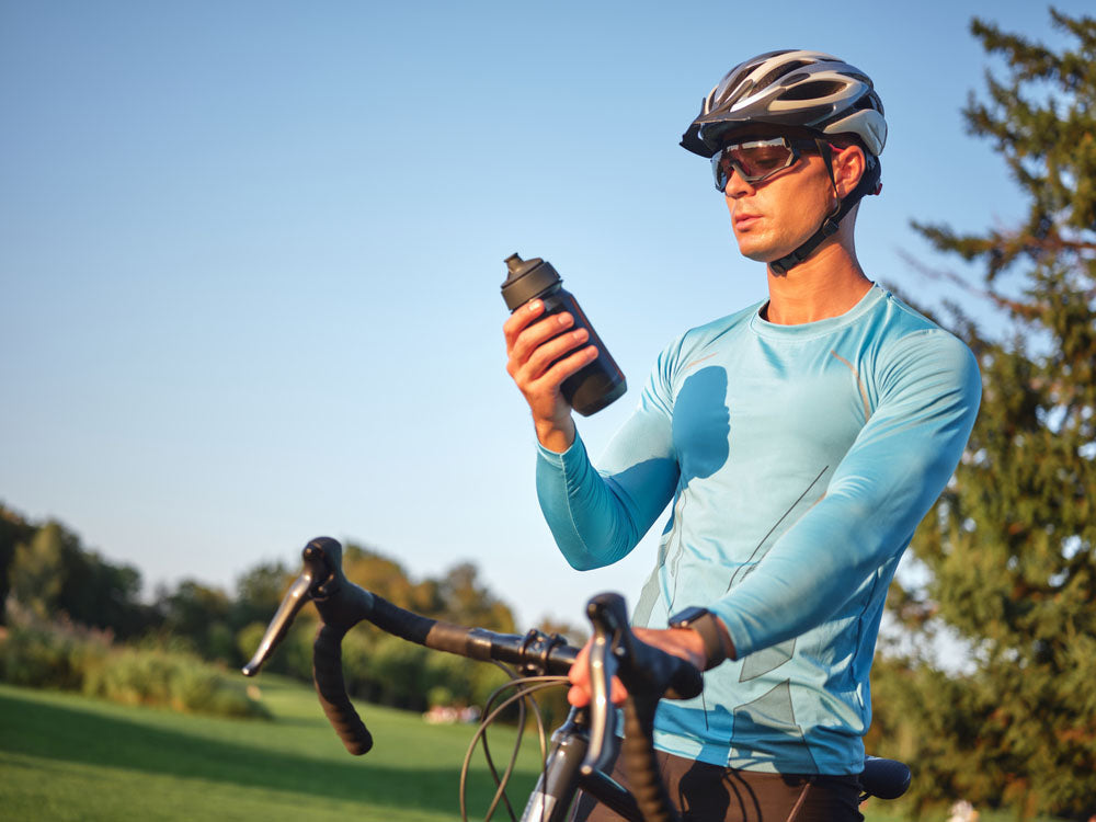 cyclist holding bottle