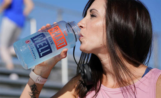 woman drinking from bottle