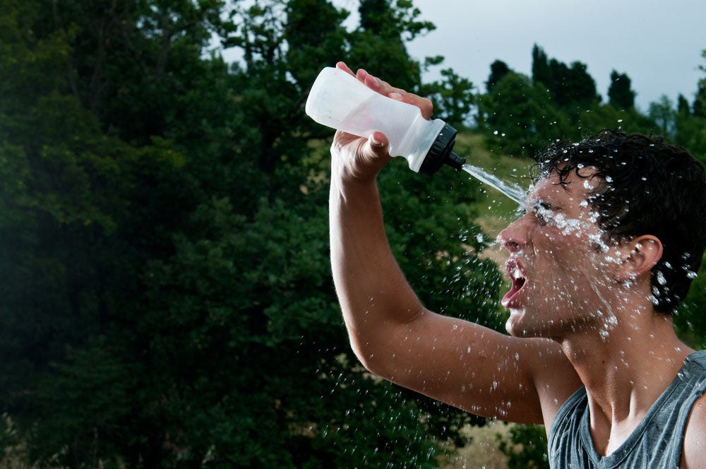 exhausted athlete cooling off with water