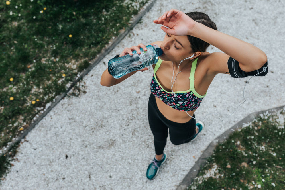 jogger drinking water bottle