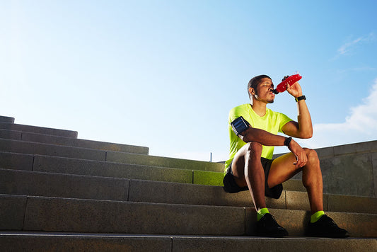 man drinking sports drink