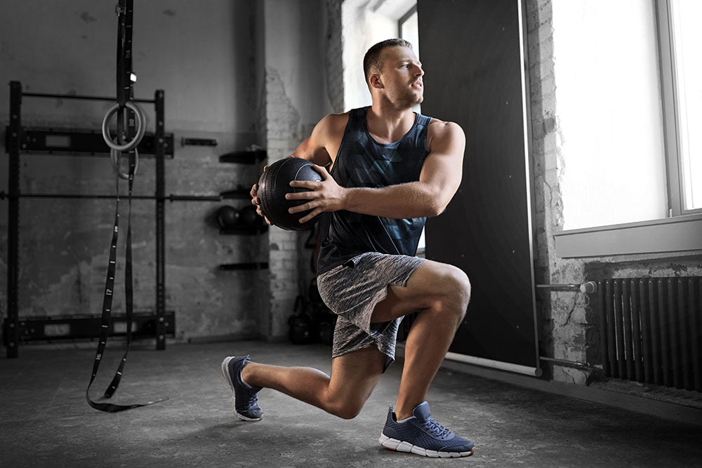 man exercising with medicine ball