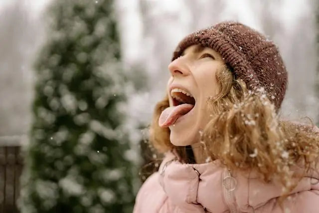 girl eating snowflakes