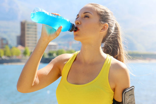 woman drinking sports drink