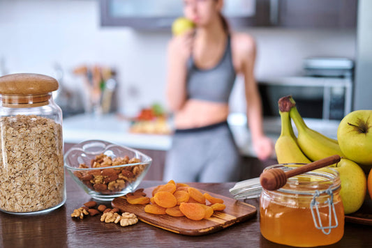 woman in background health foods in foreground