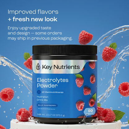 A blue container of Electrolyte Recovery Plus Powder (Sugar-Free) with raspberries and splashing water.