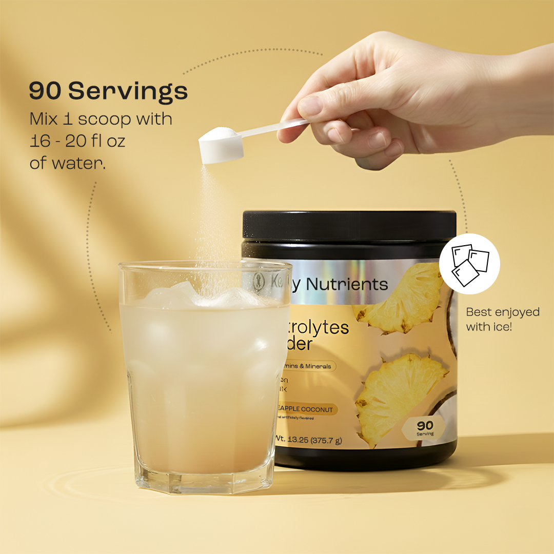 Scooping Electrolyte Recovery Plus Powder (Sugar-Free) into pineapple drink beside supplement container.