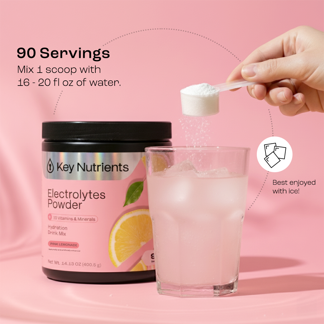 A hand adds Electrolyte Recovery Plus Powder (Sugar-Free) to pink lemonade beside the container.