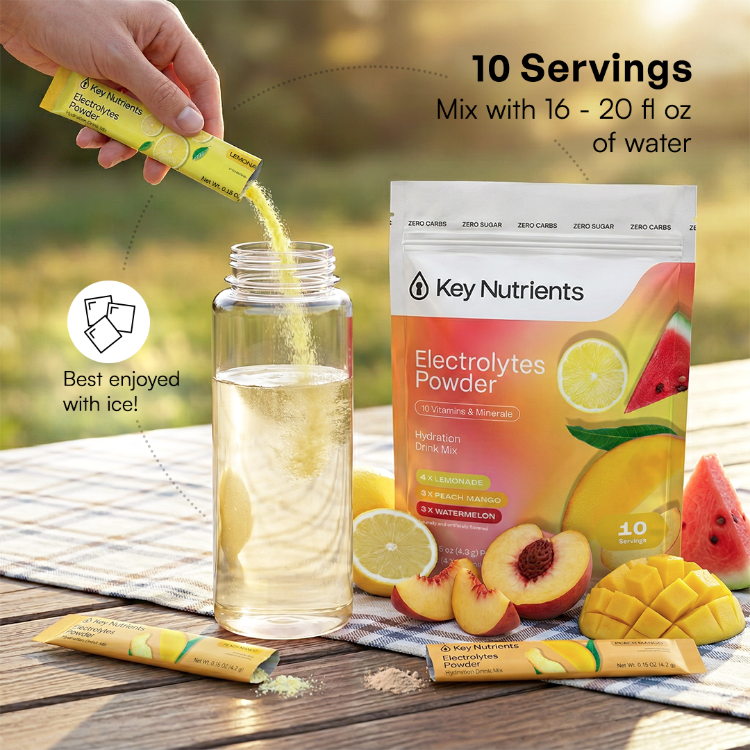 A hand pours Electrolytes Powder Variety Pack into a bottle, next to fresh fruit and drink mix.