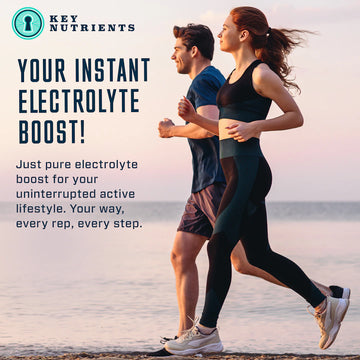 Two people jogging on the beach, powered by Electrolyte Hydration Pills for optimal performance.