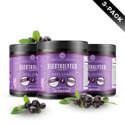 Three jars of Electrolyte Recovery Plus Powder (Sugar-Free) sit elegantly, surrounded by fresh acai berries and lush leaves, offering the perfect hydration drink for those seeking a delicious boost.