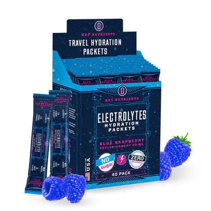 Package of Electrolyte Recovery Plus Powder (Sugar-Free), blue raspberry flavor, next to fresh blue raspberries.