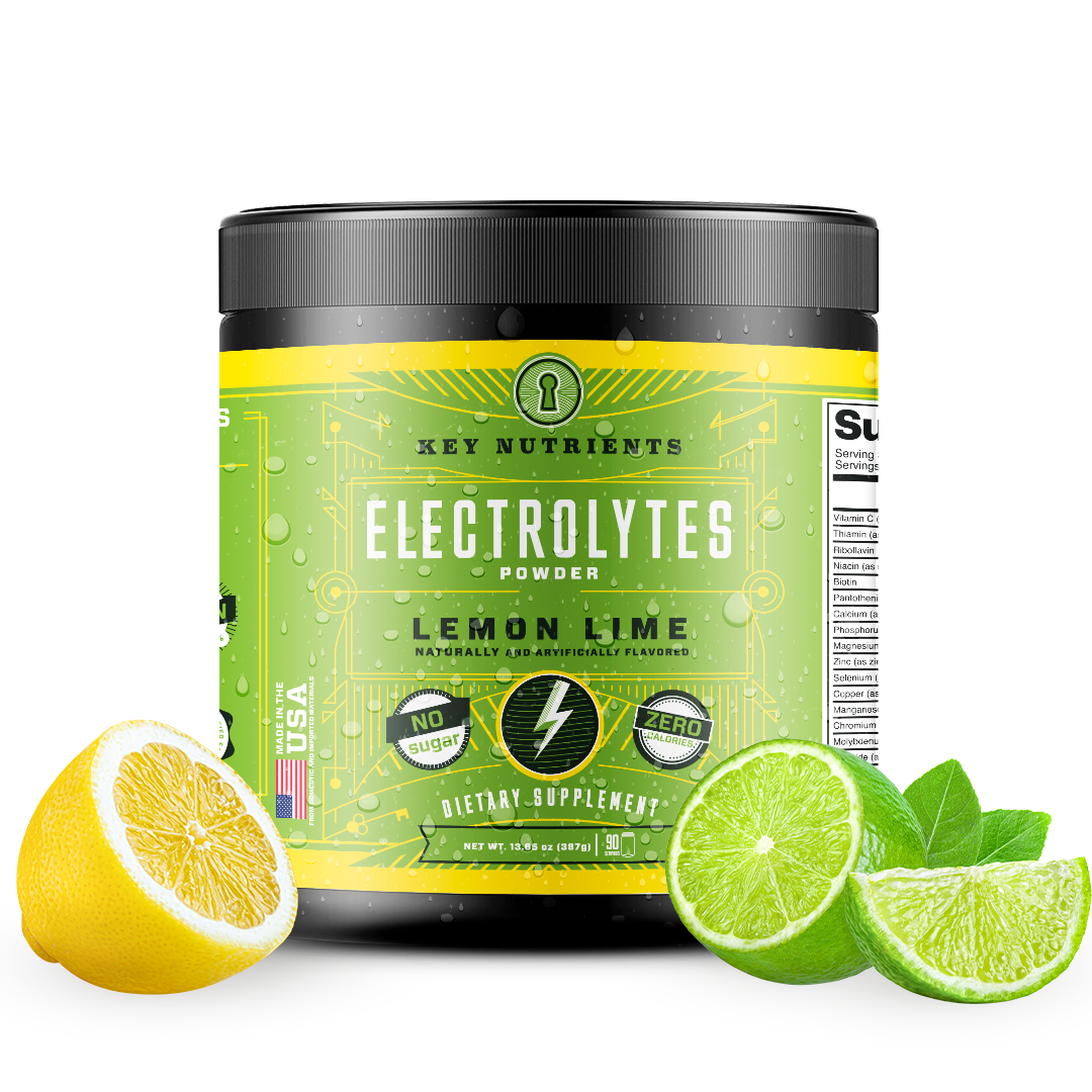 A container of Electrolyte Recovery Plus Powder (Sugar-Free) in green sits surrounded by slices of lemon and lime, offering a refreshing hydration drink that's ideal for the keto diet.