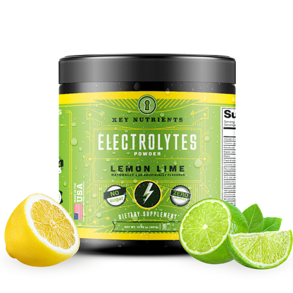 A container of Electrolyte Recovery Plus Powder (Sugar-Free) in green sits surrounded by slices of lemon and lime, offering a refreshing hydration drink that's ideal for the keto diet.