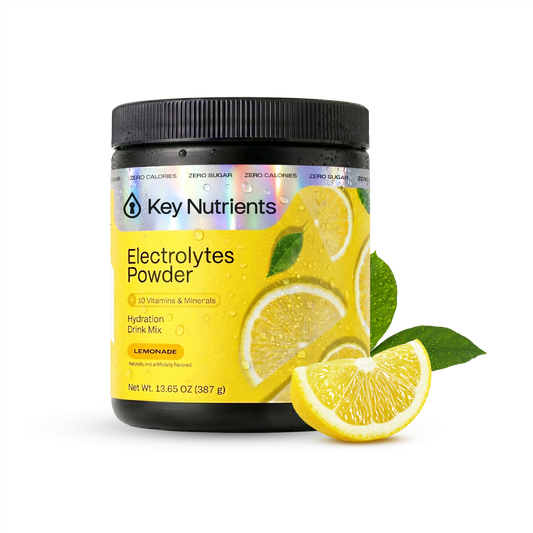 A container of Electrolyte Recovery Plus Powder (Sugar-Free), Lemonade flavor, with lemon slice and leaf.