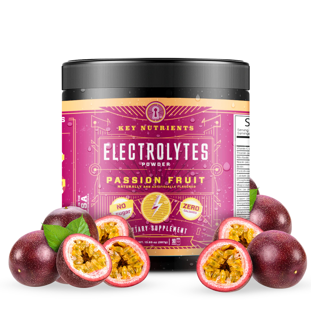 A jar of Electrolyte Recovery Plus Powder (Sugar-Free) with passion fruit flavor sits surrounded by fresh passion fruits, providing a perfect hydration drink to refresh and energize.