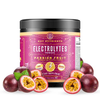 A jar of Electrolyte Recovery Plus Powder (Sugar-Free) with passion fruit flavor sits surrounded by fresh passion fruits, providing a perfect hydration drink to refresh and energize.