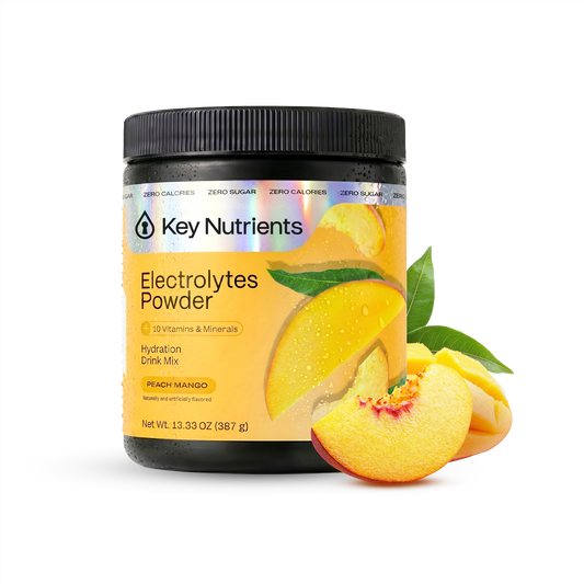 A jar of Electrolyte Recovery Plus Powder (Sugar-Free) in peach mango flavor with fresh fruit slices.