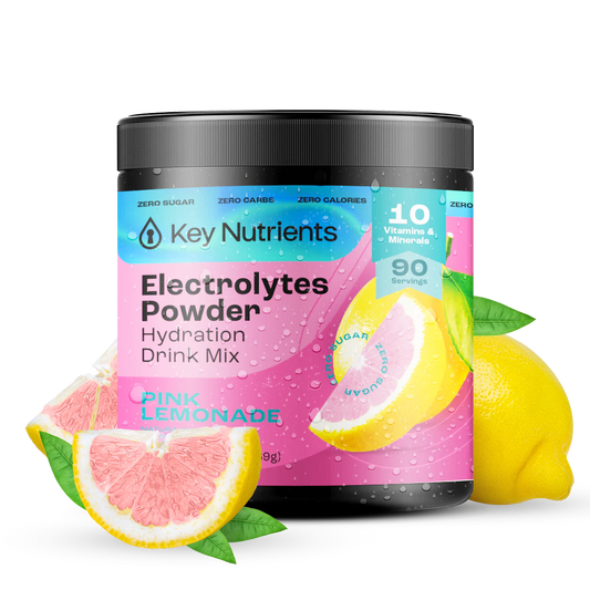 Pink Lemonade - 90 servings A jar of Electrolyte Recovery Plus Powder (Sugar-Free) sits enticingly beside pink lemonade and lemon slices, offering a refreshing hydration drink.