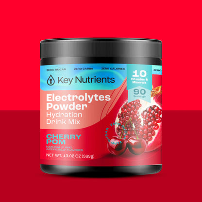 The Electrolyte Recovery Plus Powder (Sugar-Free) container is set against a vibrant red background, accentuating juicy cherries and key product details. Ideal for hydration drink enthusiasts, this keto-friendly formula helps keep you refreshed and revitalized.