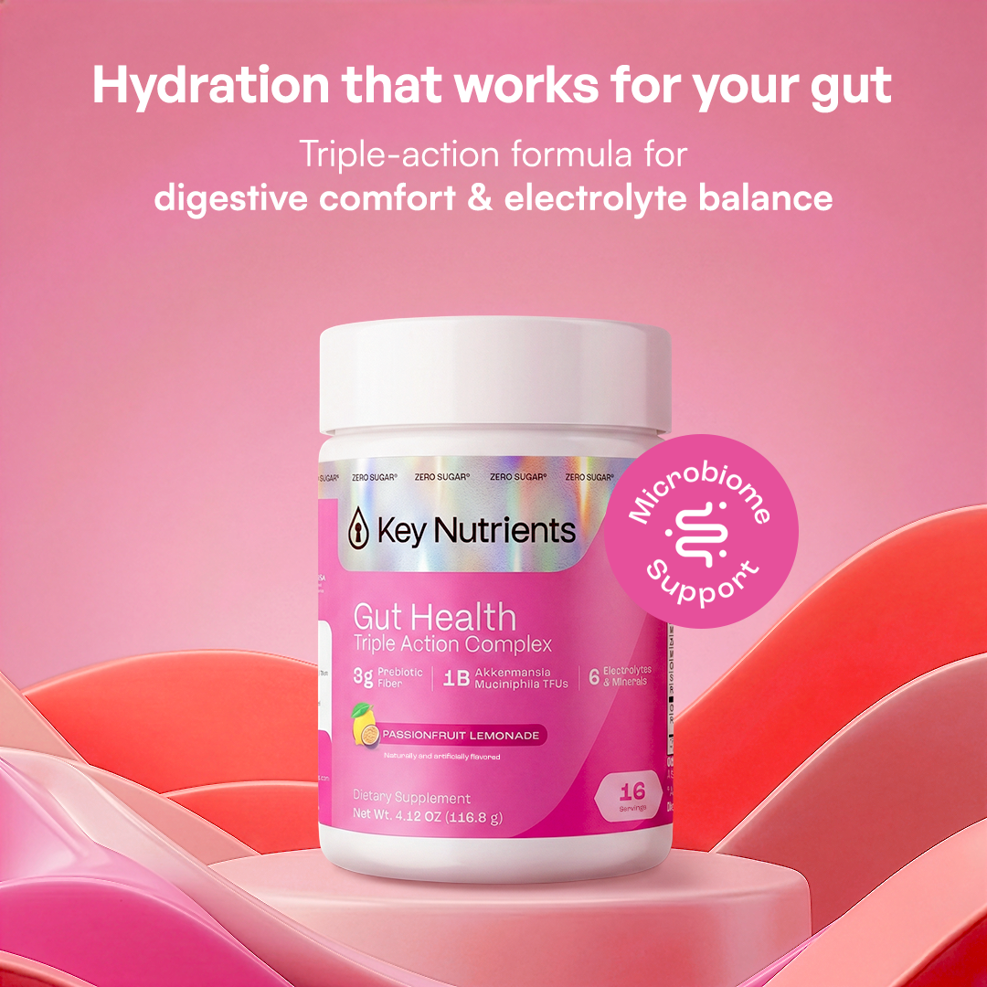 A pink Gut Health supplement bottle against a pink background, supporting hydration.