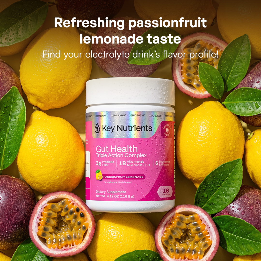 A jar of Gut Health powder for hydration, surrounded by lemons and passionfruit.