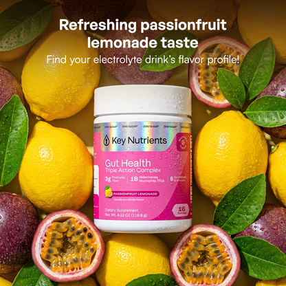 A jar of Gut Health powder for hydration, surrounded by lemons and passionfruit.
