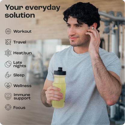 Man in gym holding Cherry Pom 20s hydration drink, adjusting earbuds. Benefits: workout, travel, sleep, focus.