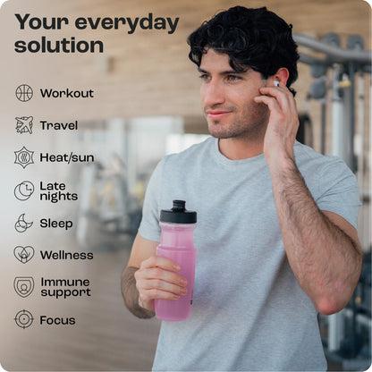 Man at the gym with pink bottle and earbuds checks out Zero Calorie Cherry Pom 20s for daily activities.