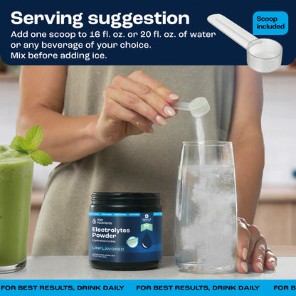 A container of Electrolyte Recovery Plus Powder (Sugar-Free) with a scoop sits beside a glass of water as the hydration drink mix is being added.